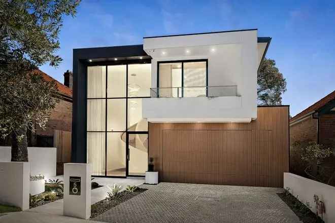 Stunning New Architectural Residence with Glass Facade and Ribbon Staircase