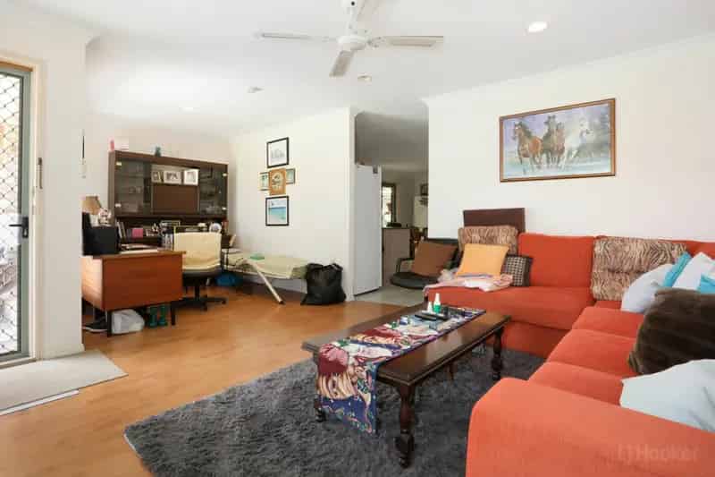 Buy 4 Bedroom Home in Coombabah with Lush Gardens and Spacious Living