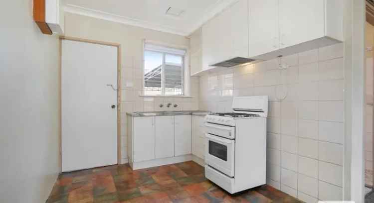 Low maintenance buy unit in quaint complex with air conditioning