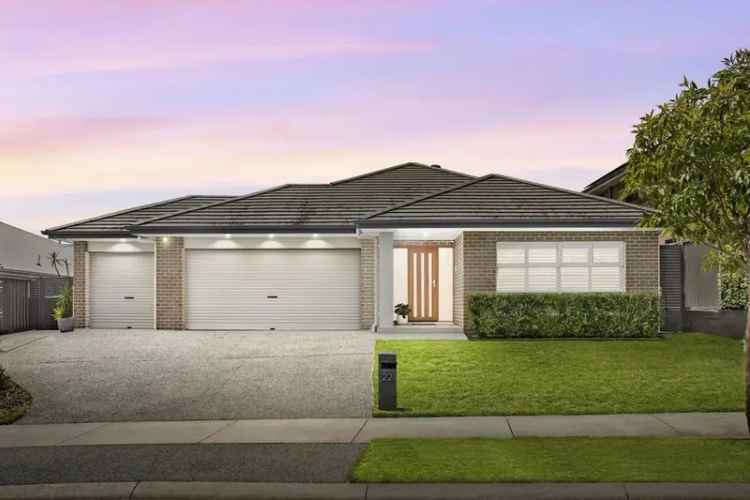 Modern 4 Bed Family Home with Triple Garage and Home Theatre