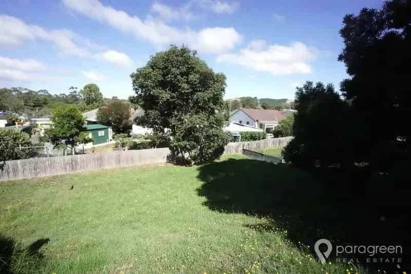Buy quarter acre block with views over town in peaceful location