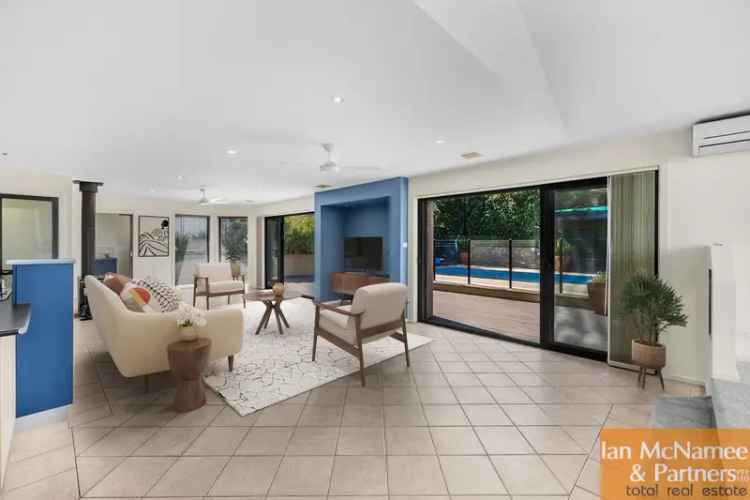 Queanbeyan Family Home: 4-Car Garage, Heated Pool, Modern Kitchen