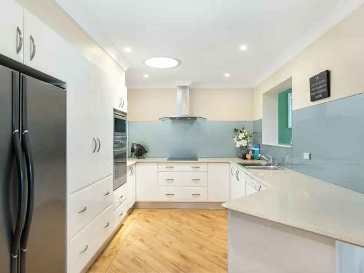 Buy house near Bateau Bay Beach with pool and modern features