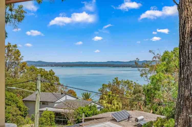 Buy large family home with great lake views in lakeside location