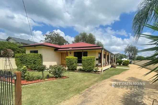 Spacious Home with Combined Living Area Low Maintenance Yard and Solar Power