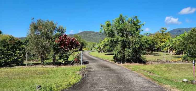 Buy rural property in Cardwell with tropical gardens and spacious living