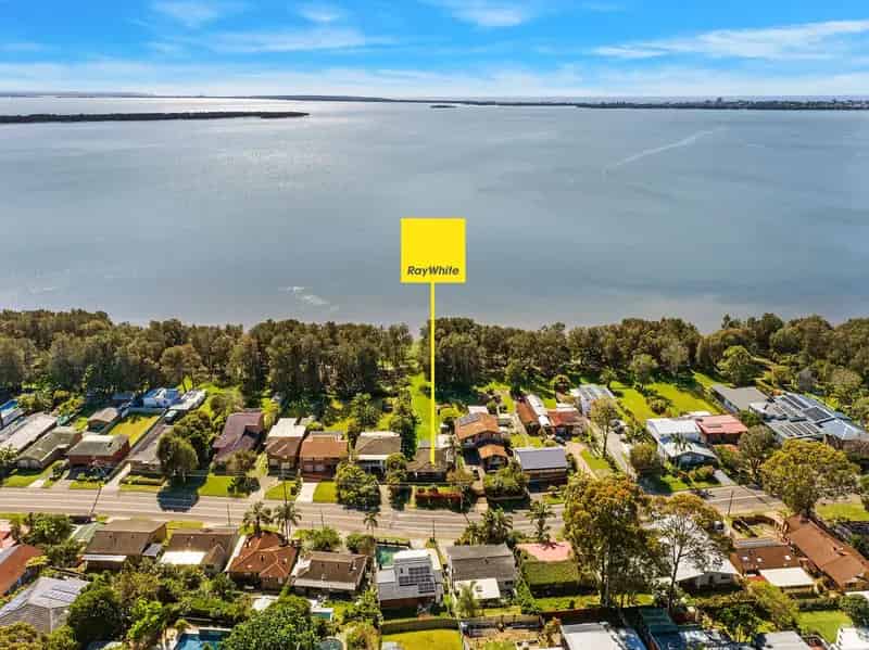 Buy house in Berkeley Vale with lake-side views and great potential