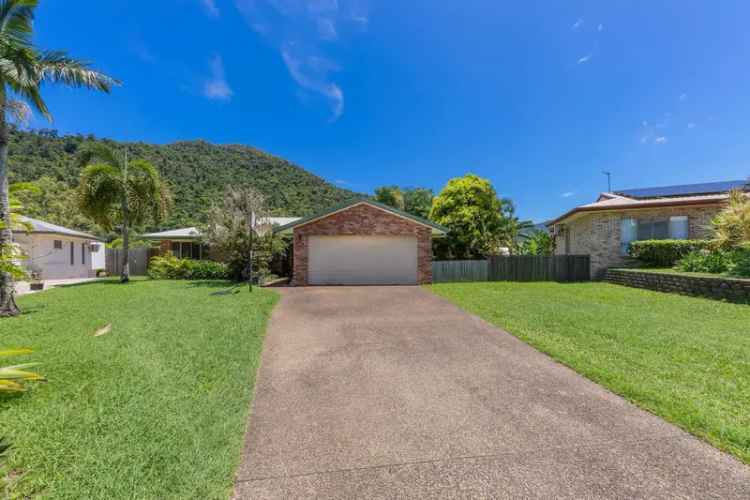 Spacious 3-Bedroom Family Home with Stunning Rainforest Views, Side Access & Investment Potential in Prestigious Cannonvale Location