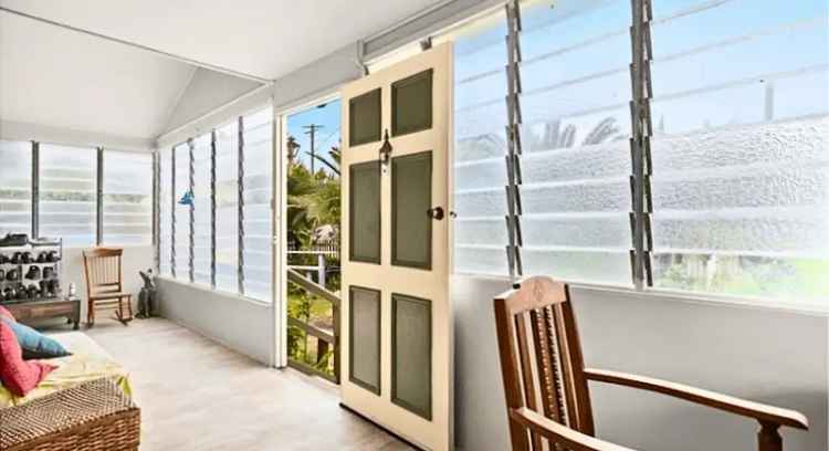 Buy Queenslander Home with 3 Bedrooms and Potential in Spacious Corner Block