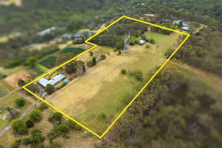 7.02 Acre Property with 5-Bedroom Home and Development Potential