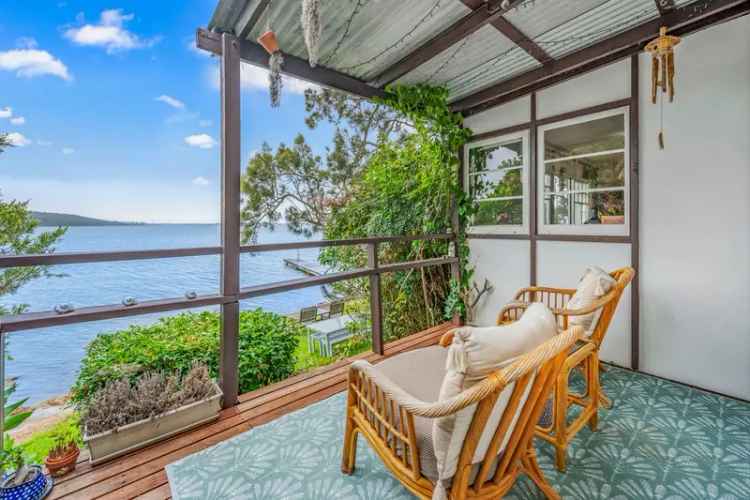 Absolute Waterfront Buy Home with Boathouse and Private Jetty