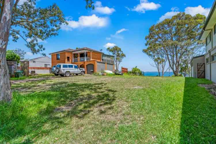 RARE WATERFRONT RESERVE BUILDING OPPORTUNITY - ALMOST LEVEL VACANT BLOCK WITH INCREDIBLE VIEWS