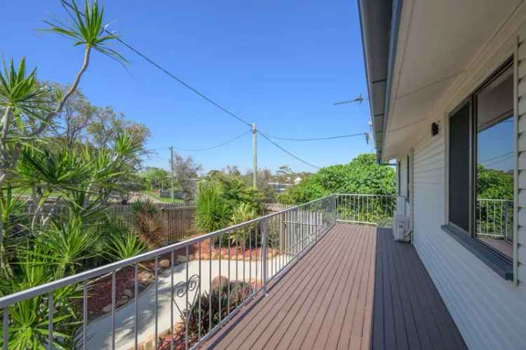 TASTEFUL RENOVATED HIGHSET HOME WITH MASSIVE ENTERTAINMENT DECK AND INGROUND POOL, WALK TO SCHOOLS AND SHOPS