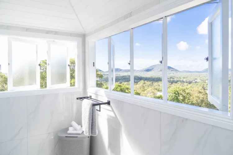 Buy stunning Queenslander home with panoramic ocean hinterland views