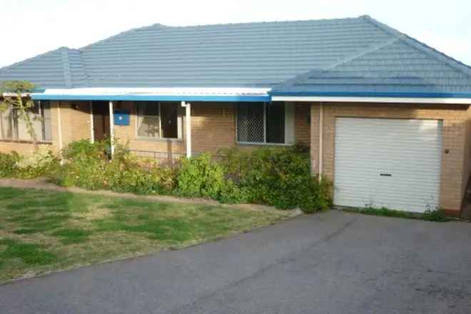 Spacious 3-Bedroom Brick Home with Ocean Views and Shed