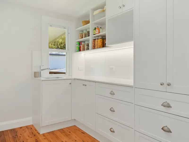 Buy renovated double brick home with commercial zoning near town