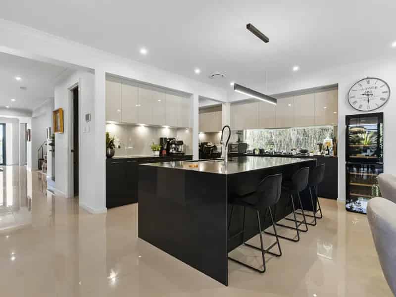 Buy House Coomera Luxurious Metricon Home with Four Bedrooms and Solar Panels