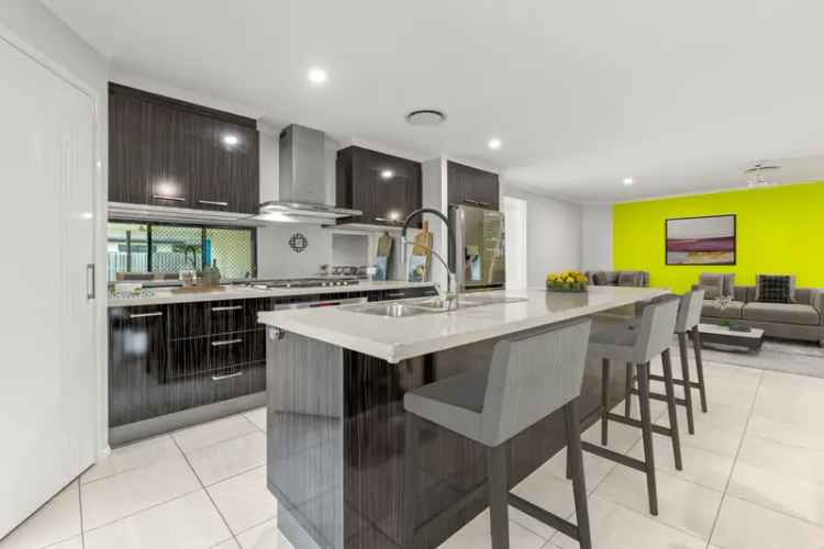 Modern Living in a Thriving Community on a 661m2 corner block with side access!