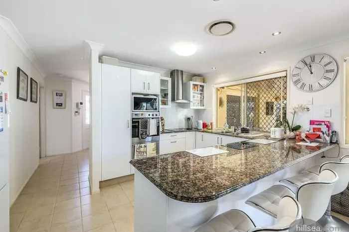 Family Home in Helensvale with Private Gated Entrance and Outdoor Entertaining Area