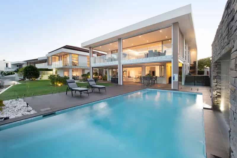 Buy Modern Waterfront House in Exclusive Sanctuary Cove with Luxury Features