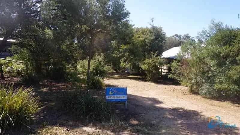 Buy Land in Quiet End of Town with Fenced Level Lot and Caravan