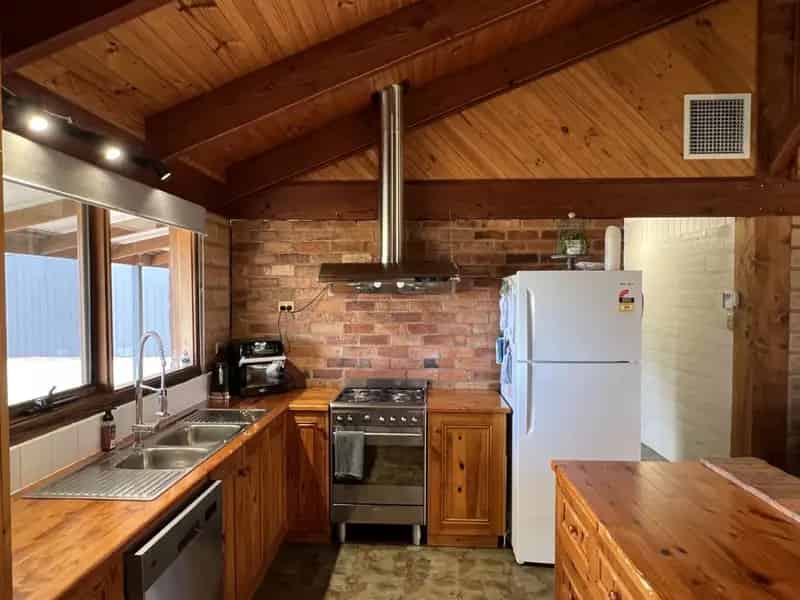 Buy Rural Property in Mudbrick Home with Sheds and Carport