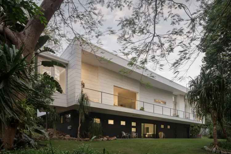 Tranquil Tree-Lined Living in this Architectural Abode