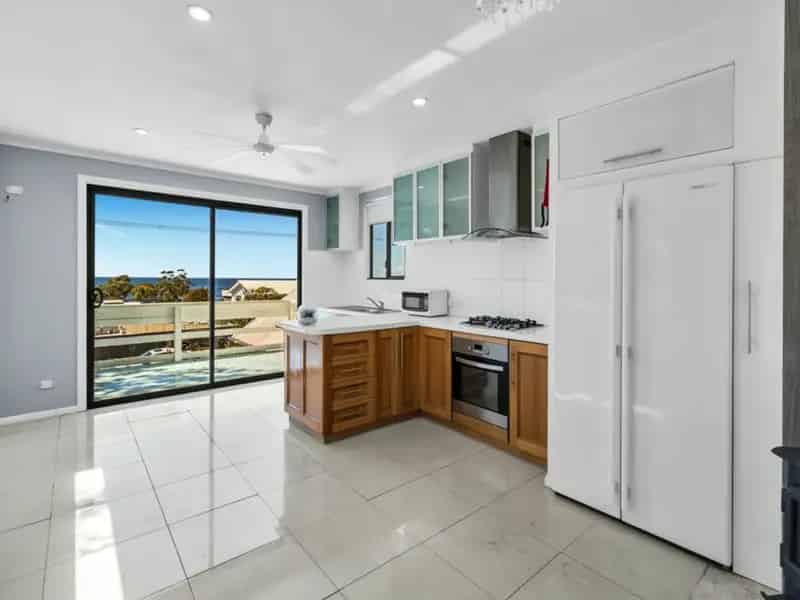 Buy beach house with water views in serene location