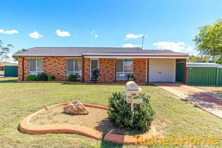 Three Bedroom Family Home with Large Backyard and Carports