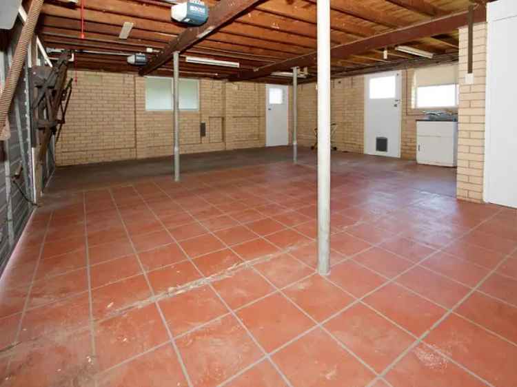 Spacious 3 Bedroom Brick Home with Ample Storage and Workshop