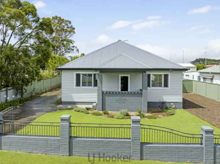 Buy house in Boolaroo with modern features and ample parking