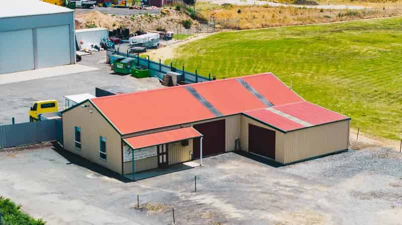 Buy warehouse in Youngtown with light industrial zoning for trade or investment
