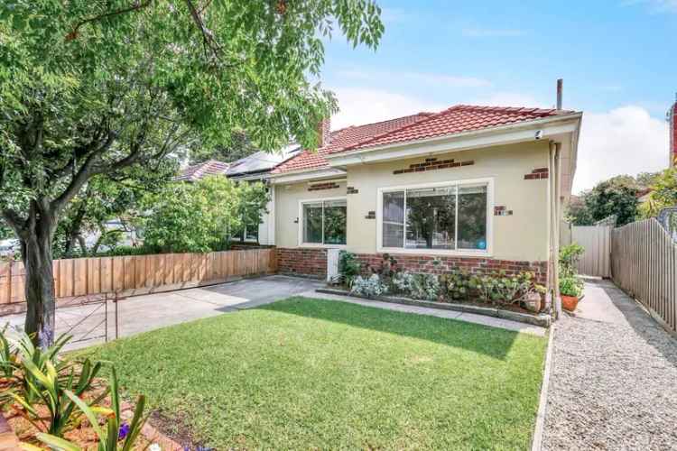 Classic 1930s Brick Home with Charm and Potential