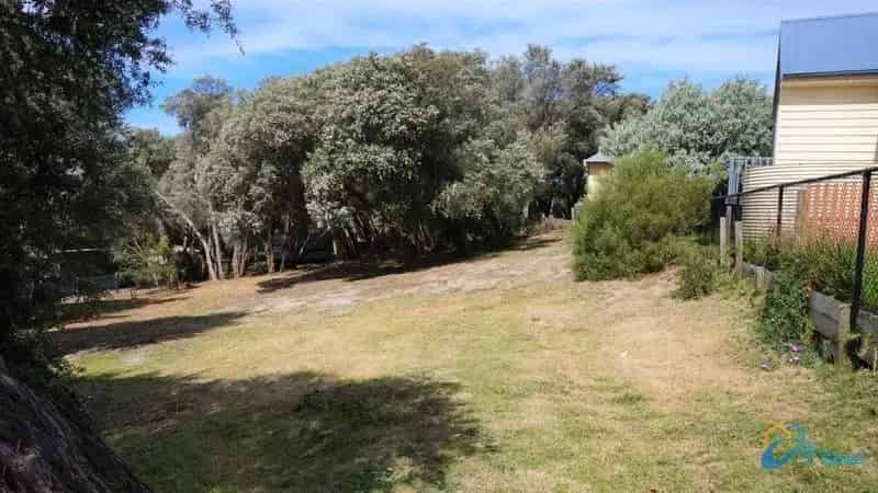 Buy land near Lake Victoria with established trees and proximity to amenities