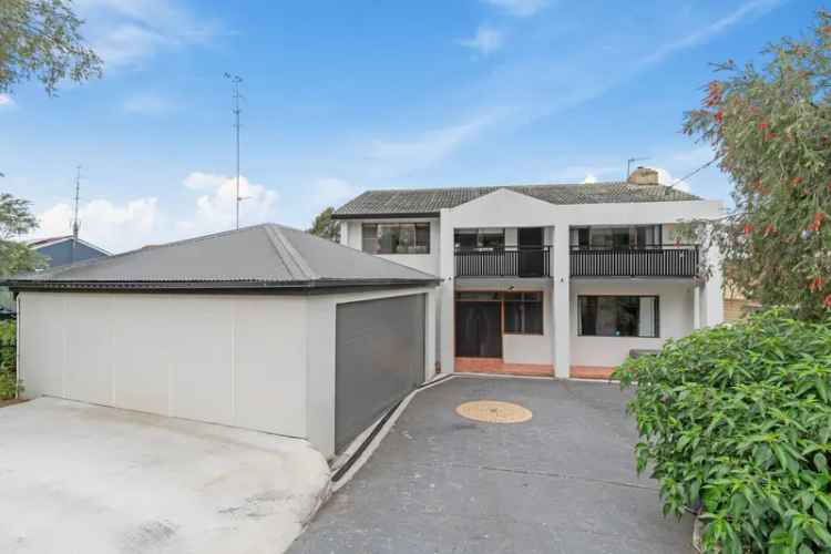 Buy House in Dapto with Spacious Layout and Modern Kitchen