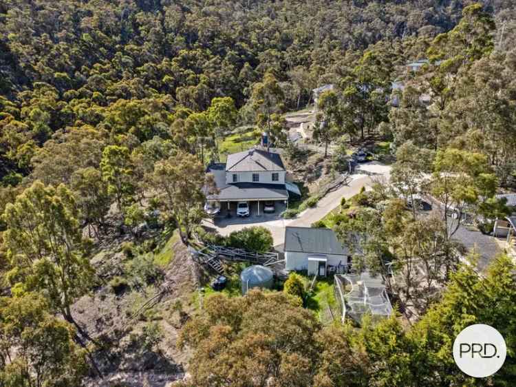 Expansive Family Oasis with Dual Living & Stunning Bushland Views, Just 30 Minutes from Hobart!