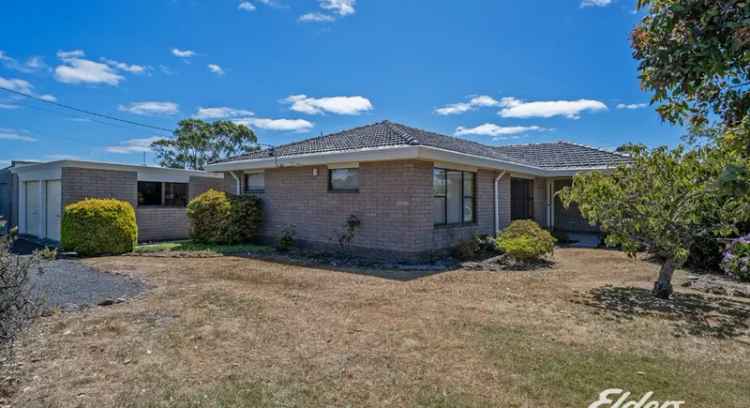 Buy house in Smithton with open plan living near river and town tracks