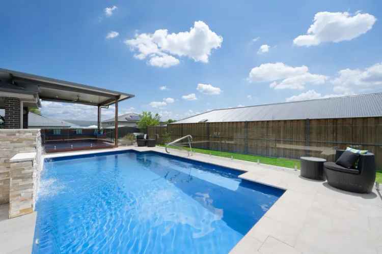 Spacious Family Home with Resort-Style Pool in Glenmore Park