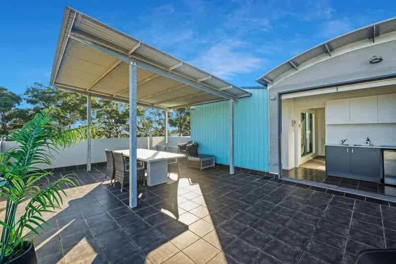 Coastal Living at Its Finest - Double-Level Apartment with Water Views