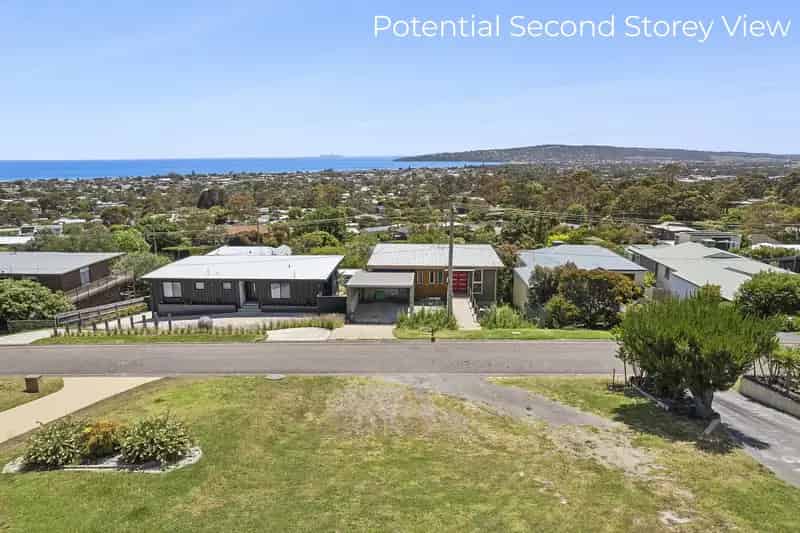 Buy hillside land in coastal location with stunning bay views