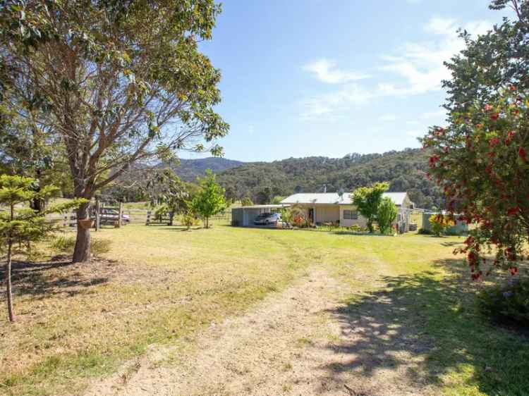 Buy rural property with river frontage and two homes in Burragate