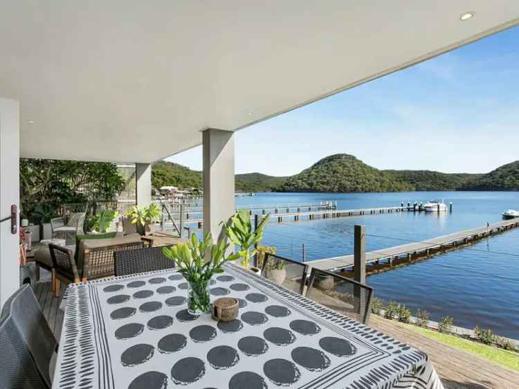 Buy waterfront home in Woy Woy Bay with private jetty and stunning views