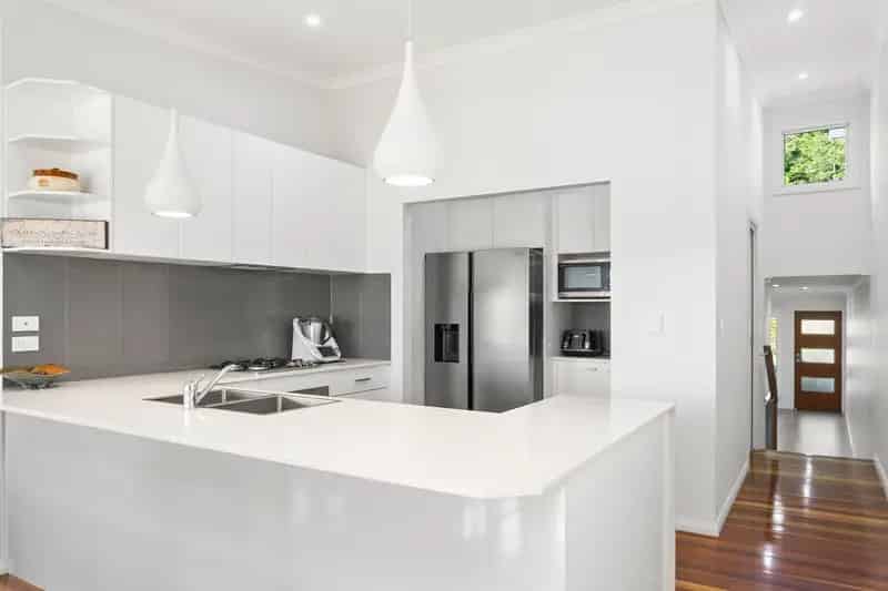 ELEVATED COASTAL ELEGANCE: A FAMILY HAVEN WITH PREMIUM GOLF COURSE VISTAS