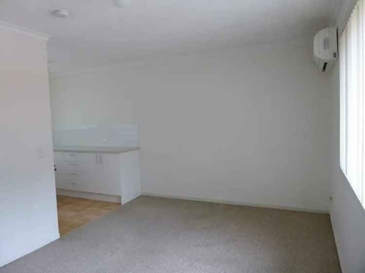 2 Bed Unit in Quiet Complex - Air Con, Modern Kitchen, Garage