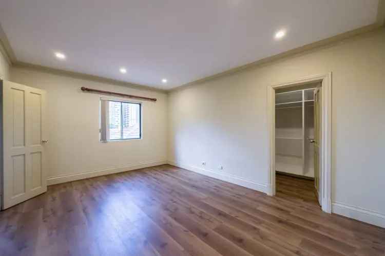 Lease 4 Bedroom Apartment in Burwood with Expansive Balcony and Air Conditioning