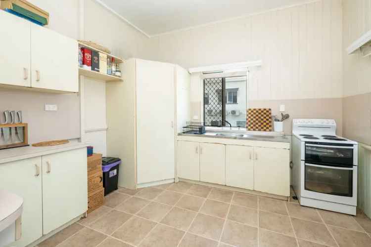 Invest in a Fully Fenced Home Near Mater Hospital with Great Rental Return