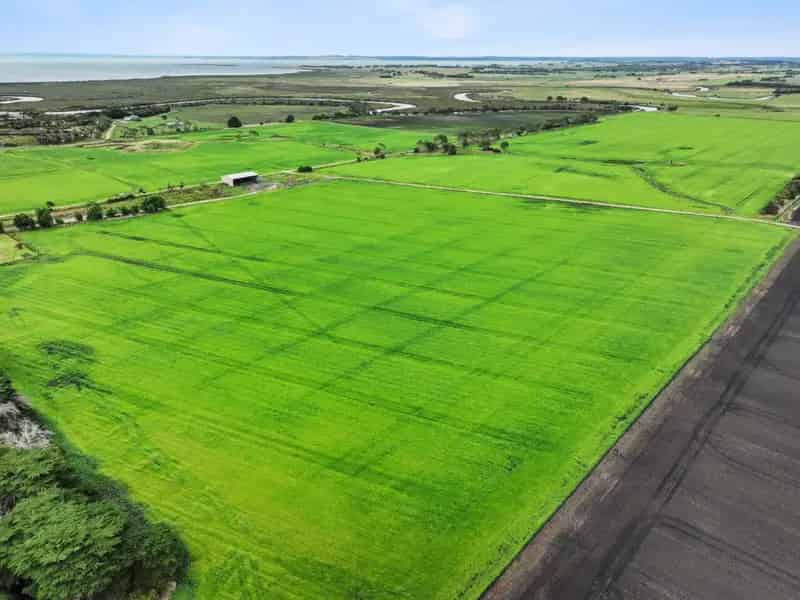 Buy Rural Property with River Frontage in Bass Featuring Home and Sheds