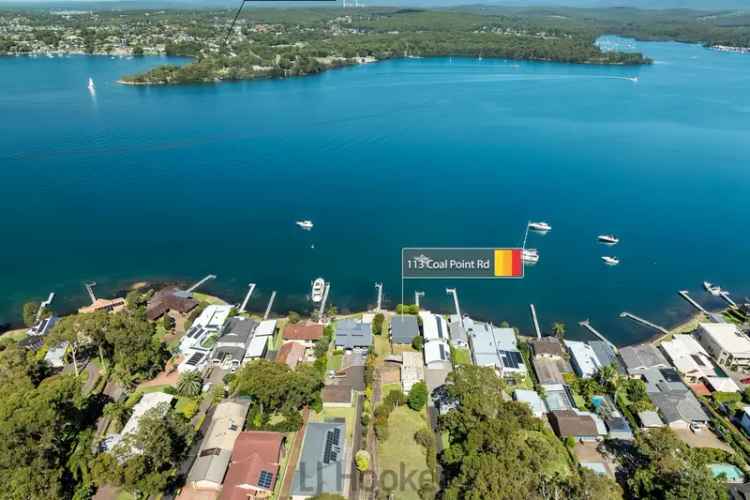 Waterfront Renovate or Build Opportunity at Coal Point with Boating Facilities