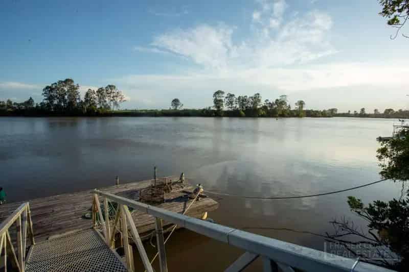 Buy Rural Property with Riverfront Access and Multiple Sheds in Dundathu