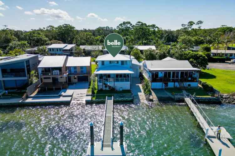 Buy Riverside House with Luxurious Design and Waterfront Views